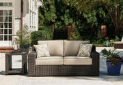 Coastline Bay Outdoor Loveseat with Cushion -  Ashley Furniture Outdoor Seating  Fresh Start Furniture
