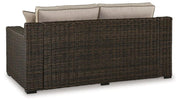 Coastline Bay Outdoor Loveseat with Cushion -  Ashley Furniture Outdoor Seating  Fresh Start Furniture