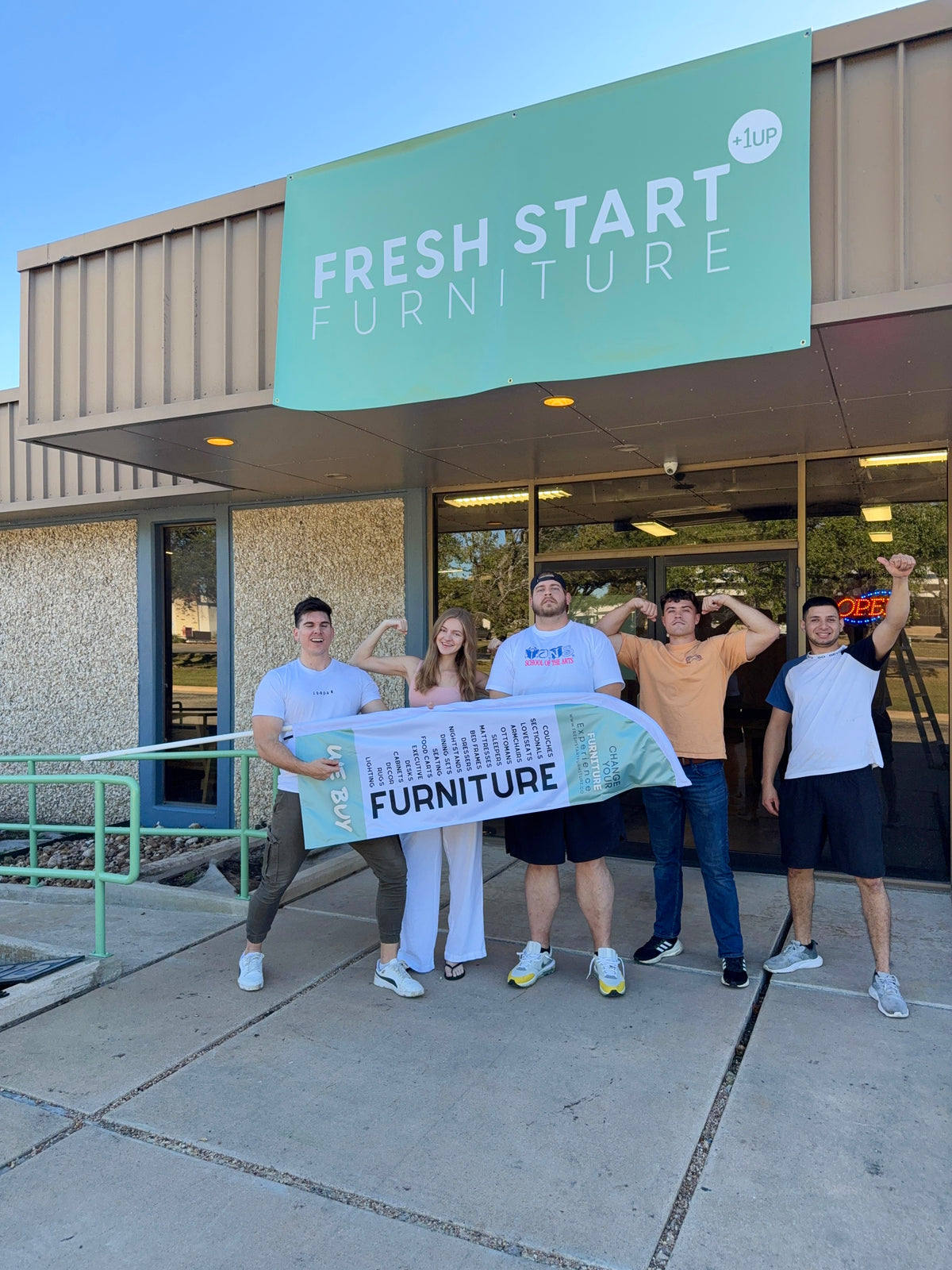 The Fresh Start Furniture team outside the Kramer Lane showroom in Austin